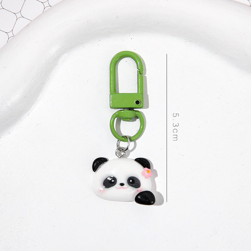 4 slumpmässiga söta panda-nyckelringar i tecknad stil