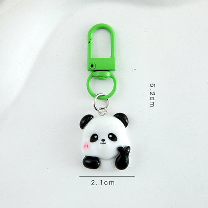 4 slumpmässiga söta panda-nyckelringar i tecknad stil