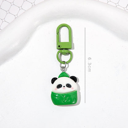 4 slumpmässiga söta panda-nyckelringar i tecknad stil