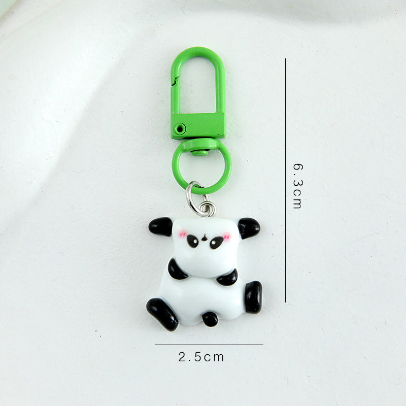 4 slumpmässiga söta panda-nyckelringar i tecknad stil