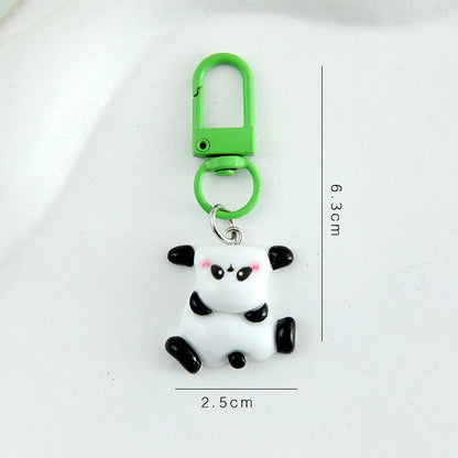 4 slumpmässiga söta panda-nyckelringar i tecknad stil