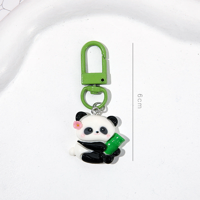 4 slumpmässiga söta panda-nyckelringar i tecknad stil