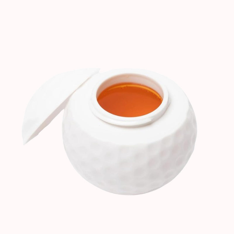 Kreativt shotglas i form av en golfboll